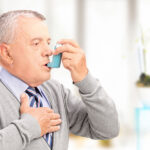 Elderly man with Asthma inhaler