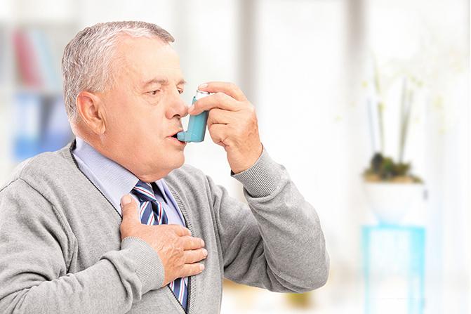 Elderly man with Asthma inhaler